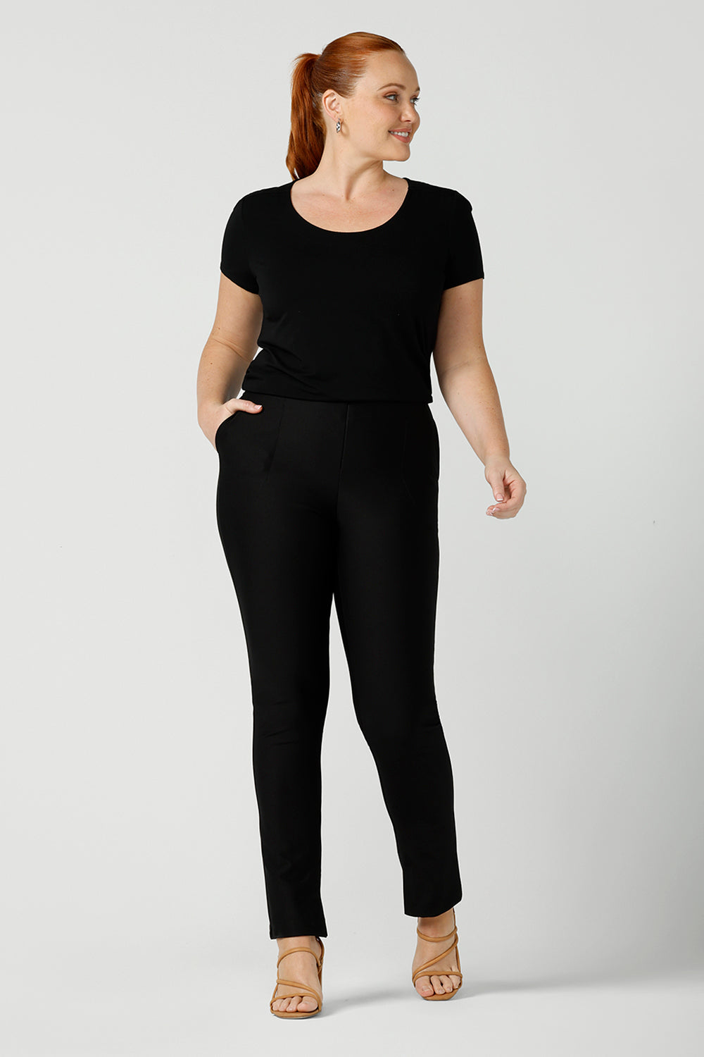 A good black top for your capsule wardrobe, this round neck, short sleeve top in black bamboo jersey is comfortable for work and casual wear. Worn with slim leg black work pants, both are made in Australia by ladies clothing brand, Leina & Fleur. Shop black tops for women online in sizes 8 to 24 in L&F's online fashion boutique