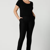 A good black top for your capsule wardrobe, this round neck, short sleeve top in black bamboo jersey is comfortable for work and casual wear. Worn with slim leg black work pants, both are made in Australia by women's clothing brand, Leina & Fleur. Shop black tops for women in Australia online in sizes 8 to 24 in L&F's online fashion boutique