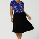 Size 16 curvy woman wears the Sawyer top a scoop neckline top on a polka dot print with a cobalt base. Made in Australia for women size 8 to 24.