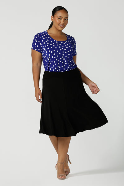 Size 16 curvy woman wears the Sawyer top a scoop neckline top on a polka dot print with a cobalt base. Made in Australia for women size 8 to 24.