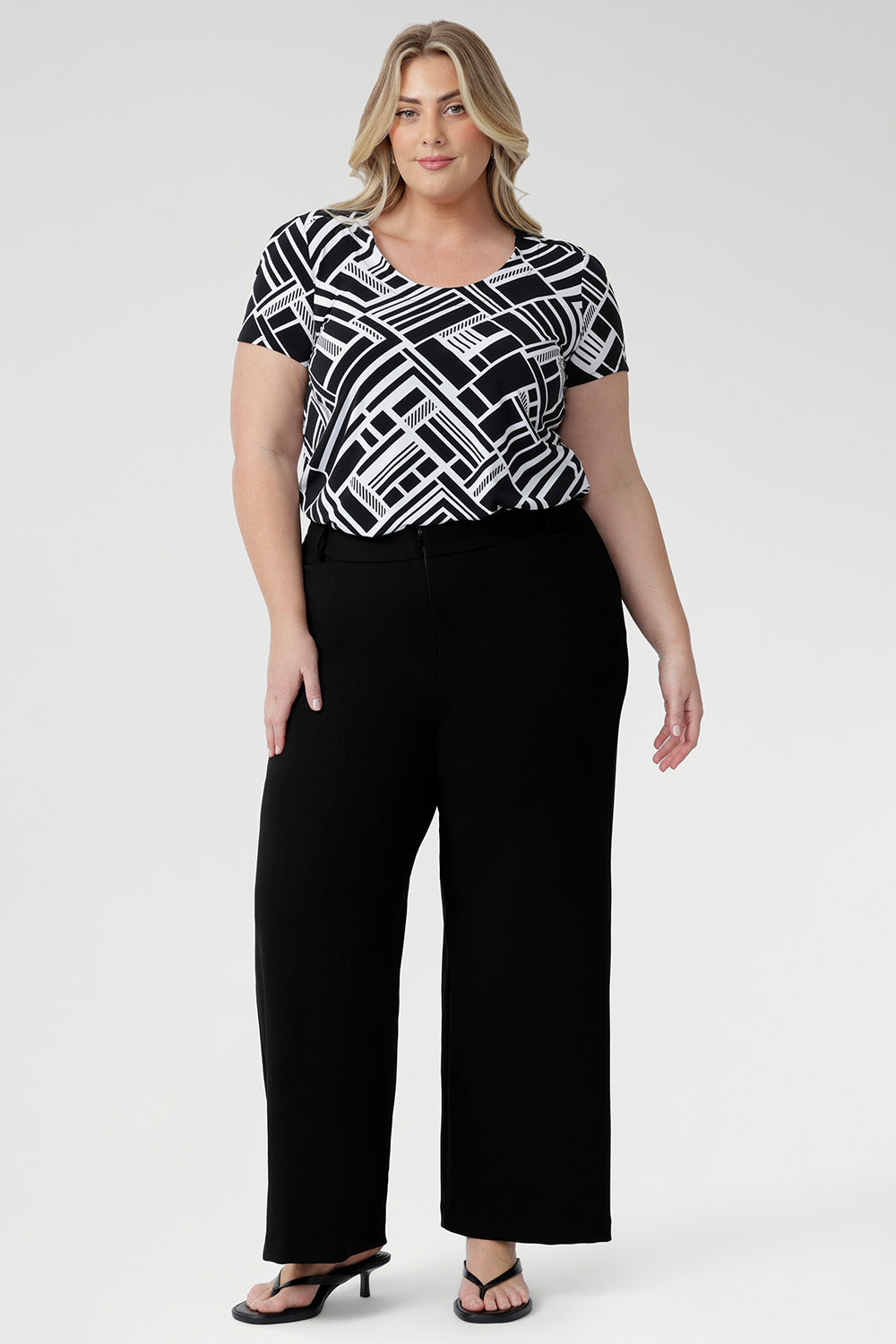 The Sawyer Top is a women's blouse with scoop neckline and pairs beautifully with skirts, trousers, and denim for effortless everyday styling. Short sleeved top is perfect for everyday styling and fits comfortably under blazers. 
