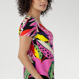 Lightweight, breathable, and smooth on the skin, it features a classic round neckline, short fitted sleeves, and a curved shirttail hem—elevated comfort, every day. 