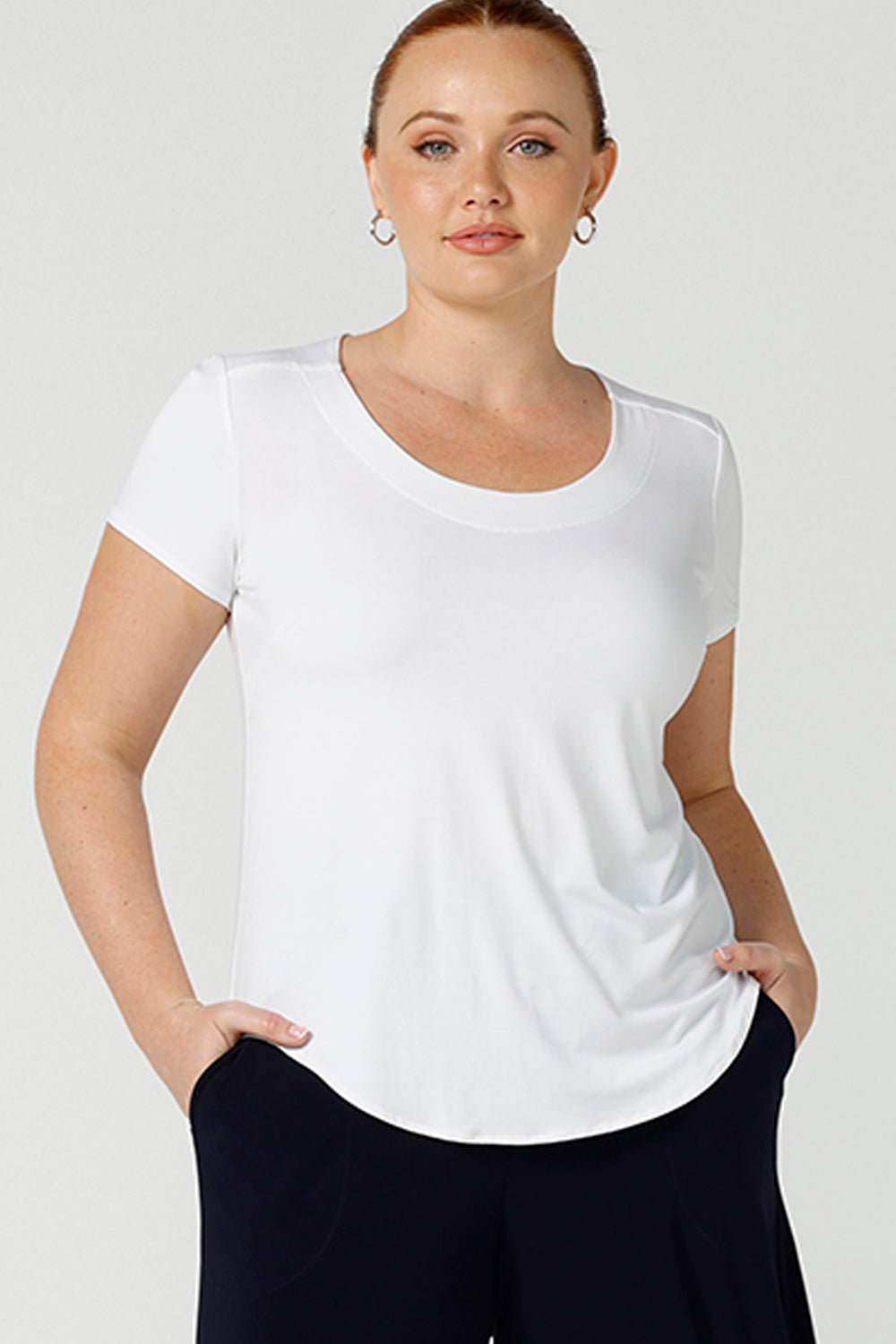 A good example of ladies clothing in Australia, this round neck, short sleeve top in white bamboo jersey is shown in a size 12 on a curvy woman.  If you're seeking a ladies casual top then this white tee top by Australian women's online clothing brand, Leina & Fleur,  is the perfect edition to your capsule wardrobe!
