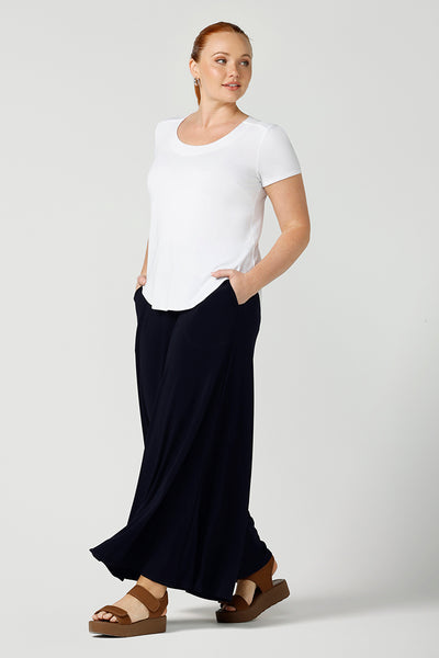 A good example of ladies clothing in Australia, this round neck, short sleeve top in white bamboo jersey is shown in a size 12 on a curvy woman. Worn with navy, wide leg palazzo pants, if you're seeking a ladies casual top then this white tee top by affordable, ethical clothing brand in Australia,  Leina & Fleur  is the perfect edition to your capsule wardrobe!