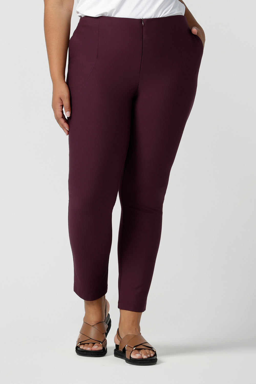 Great pants for plus size, curvy women, these slim leg, cropped length tailored pants are shown on a size 18 woman. Made in Australia by Australian and New Zealand women's clothing brand, L&F these work pants are available to shop online in sizes 8 to 24.