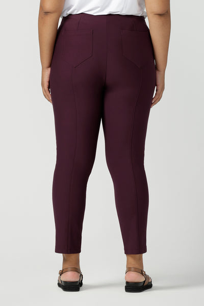 Back view of great pants for plus size, curvy women, these slim leg, cropped length tailored pants are shown on a size 18 woman. Made in Australia by Australian and New Zealand women's clothing brand, L&F these work pants are available to shop online in sizes 8 to 24.