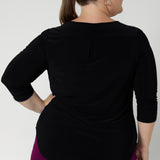 Back view image of size 18 model wears 3/4 sleeved top in black. Crafted in Australia by Leina & Fleur and available for custom pre order now in sizes 8-24.