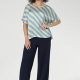 The Blue Sky Stripe print blends soft sky blue and vanilla tones, giving this tee a fresh, modern aesthetic. The diagonal stripe design adds subtle movement and visual interest to an everyday essential.