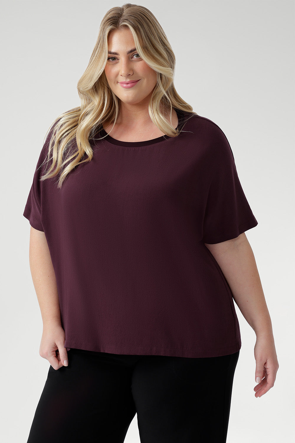 Plus size women wears Australian-made staple features a relaxed silhouette with grown-on sleeves, a bound round neckline for all-day comfort, and a clean, straight hem for a polished look. 
