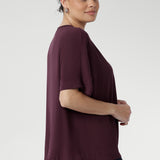The Scout Tee in Plum is your new everyday essential, crafted from luxurious, lightweight Tencel Viscose that offers a soft, velvet-like finish against the skin. Designed with a relaxed fit, it features elegant grown-on sleeves, a softly bound round neckline, and a straight hem for a clean, contemporary silhouette.