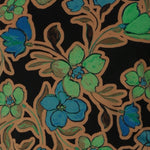 The Mason Top is an essential addition to your wardrobe, perfect as a base layer when the weather cools. Featuring chic, clean lines and an elegant boat neckline, this top offers effortless style in the Secret Garden print. The design features a black base adorned with a floral pattern in soft shades of opal blue, green, and burnt gold. Made from Dry Touch Jersey fabric with a soft stretch. Australian made in sizes 8-24.