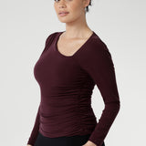 Crafted from a luxurious heavy-weight Lyocell Knit, this top is designed to flatter with its asymmetrical neckline and subtle ruching at the shoulder and sides, creating a soft, sculpted shape. The fully double-layered bodice provides a refined structure, while the long sleeves make it a versatile choice for all seasons.