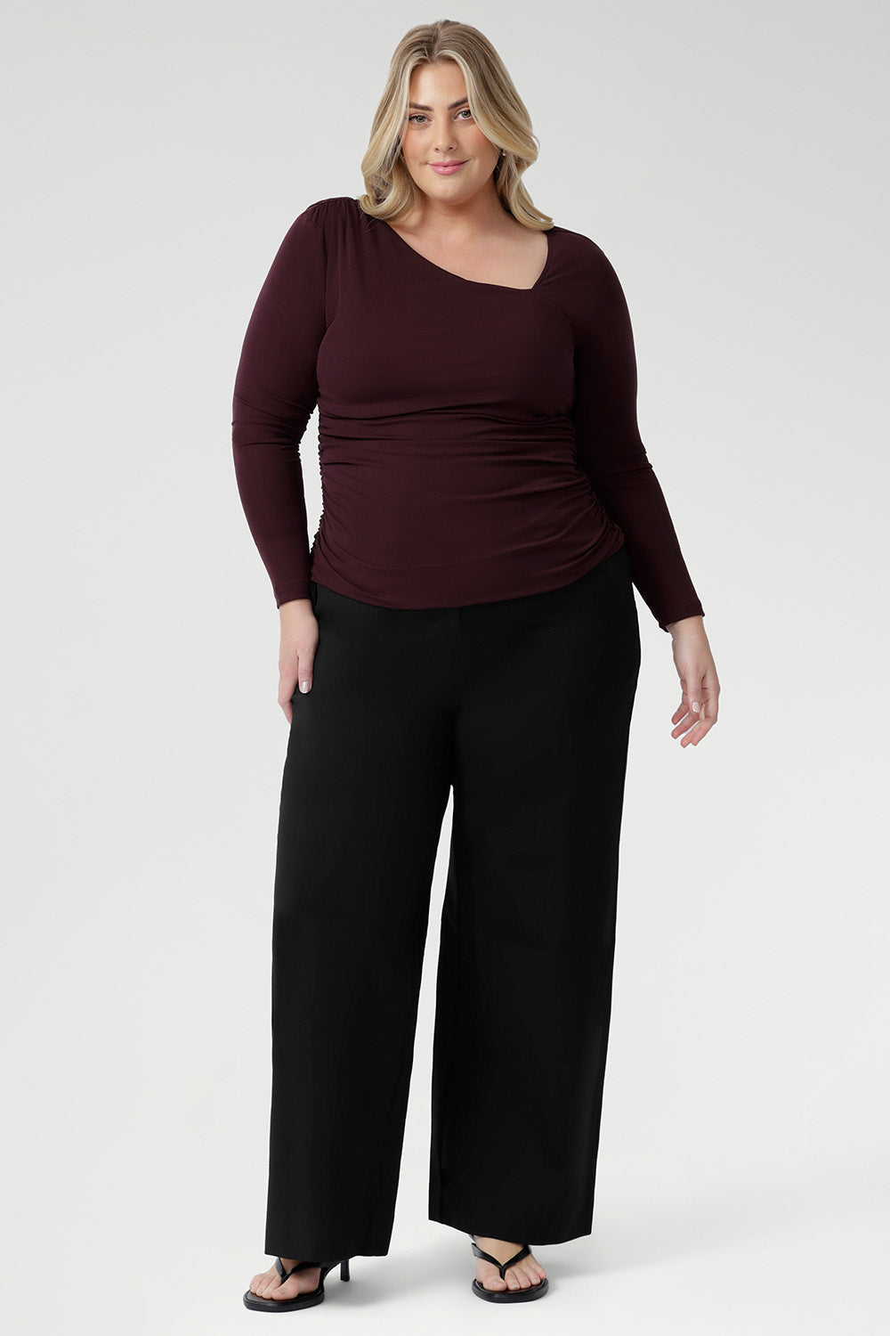 For a more refined and statement-making choice, the Simmi Top in Wine delivers a bold touch of sophistication to your wardrobe. Crafted from luxurious, heavy-weight Lyocell Knit, this flattering style is defined by its striking asymmetrical neckline and delicate ruching at the shoulder and sides, creating a beautifully sculpted silhouette.