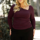 For a more elevated option, the Simmi Top in Wine brings bold sophistication to your wardrobe. Made from a luxe, heavy-weight Lyocell Knit, this flattering top features an eye-catching asymmetrical neckline with artful ruching at the shoulder and sides, creating a sculpted, feminine silhouette.