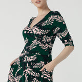 Close up of a size 10 woman wears the Simone Reversible dress in Alpine Fern. A comfortable jersey dress for women that is easy care. Made in Australia for women size 8 - 24. 