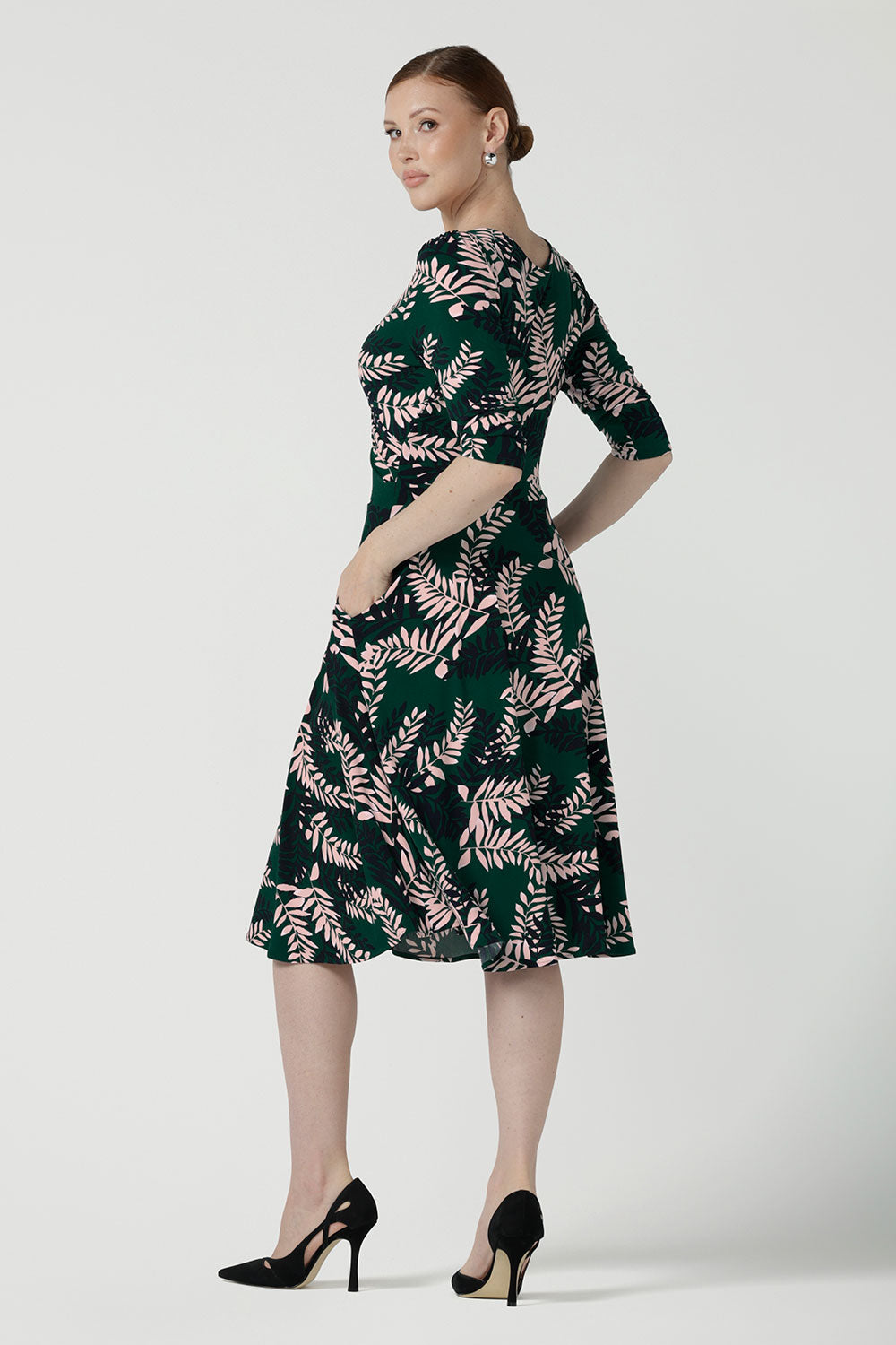 Back view of a size 10 woman wears the Simone Reversible dress in Alpine Fern. A comfortable jersey dress for women that is easy care. Made in Australia for women size 8 - 24.