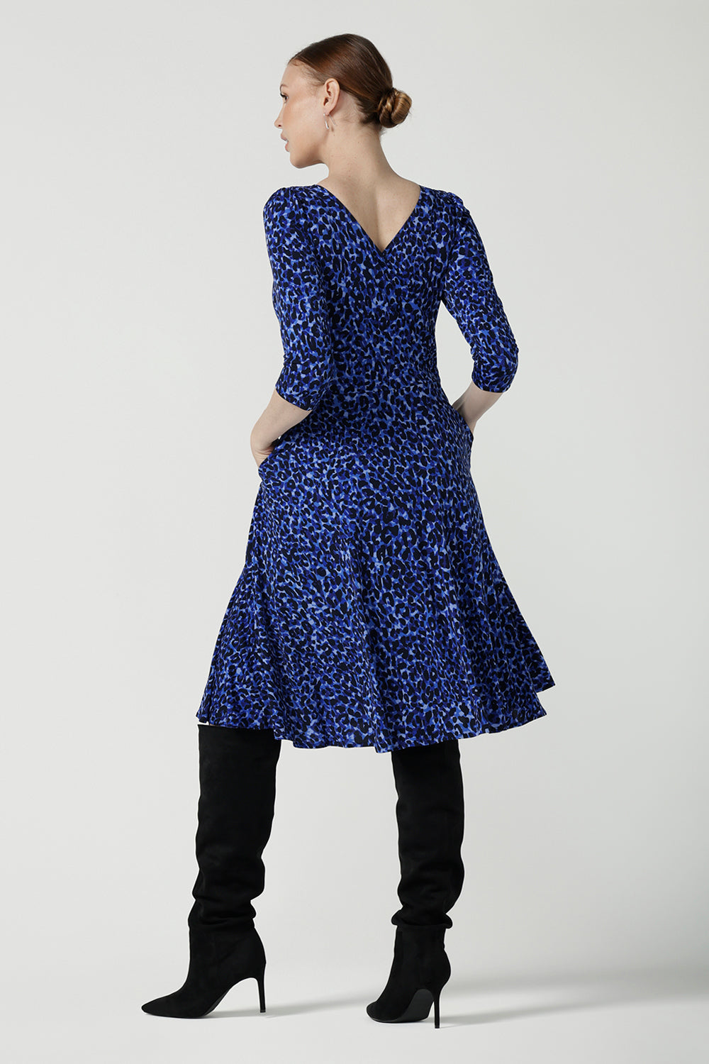 Simone reversible dress in cobalt Jaguar. Fixed wrap dress with blue printed animal print. Work to weekend and party dress. Comfortable jersey fabric. Made in Australia for women size 8 - 24.