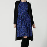 Simone reversible dress in cobalt Jaguar. Fixed wrap dress with blue printed animal print. Work to weekend and party dress. Comfortable jersey fabric. Made in Australia for women size 8 - 24.Styled back with the Marant coat in modal.