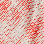 Swatch of orange spot print on ivory white Italian viscose fabric used by Australian and New Zealand womens clothing brand, Leina & Fleur to make a range of summer dresses and event wear.