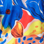 Close up image of Summer Bliss fabric swatch used to create a collection of resort ready garments including, dresses, pants and tops for women on vacation available in sizes 8-24.