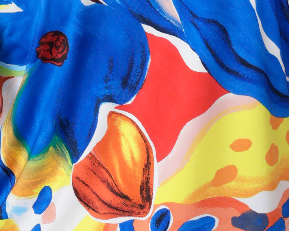 Close up image of Summer Bliss fabric swatch used to create a collection of resort ready garments including, dresses, pants and tops for women on vacation available in sizes 8-24.