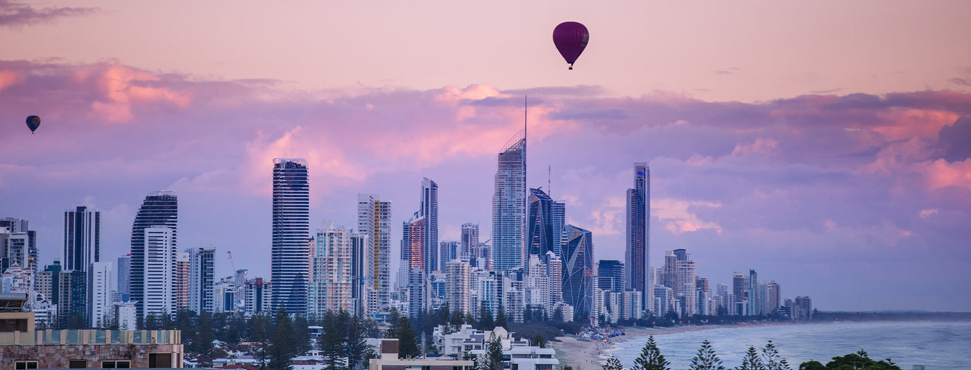 sunrise over Surfer Paradise - showcasing the best reasons to visit the Gold Coast, home to Australian-made women's clothing label, L&F's stylist studio and personal shopping experience for women.   