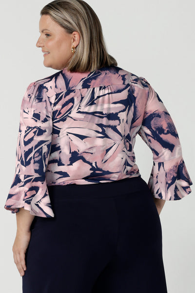 Back view of a size 18 woman wears the Tahlia top in Cantata. Fluted sleeves and a v-neckline. A great V-neckline top with 3/4 sleeves. Soft slinky jersey perfect for comfortable workwear for women size 8 - 24.