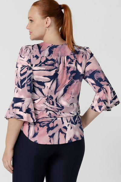 Back view of a size 12 woman wears the Tahlia top in Cantata. Fluted sleeves and a v-neckline. A great V-neckline top with 3/4 sleeves. Soft slinky jersey perfect for comfortable workwear for women size 8 - 24.