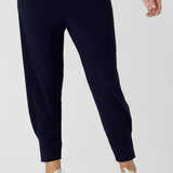 Close up of a size 10 woman wears a Navy Indi pant in jersey. A comfortable pant that is stylish and travel friendly. Made in Australia for women size 8-24. 