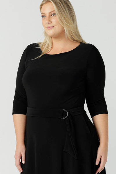 Size 18 woman wears the Melissa dress in black, a belted style with pockets and 3/4 sleeve with rounded boat neckline. Petite to plus size fashion made in Australia for women size 8 - 24.