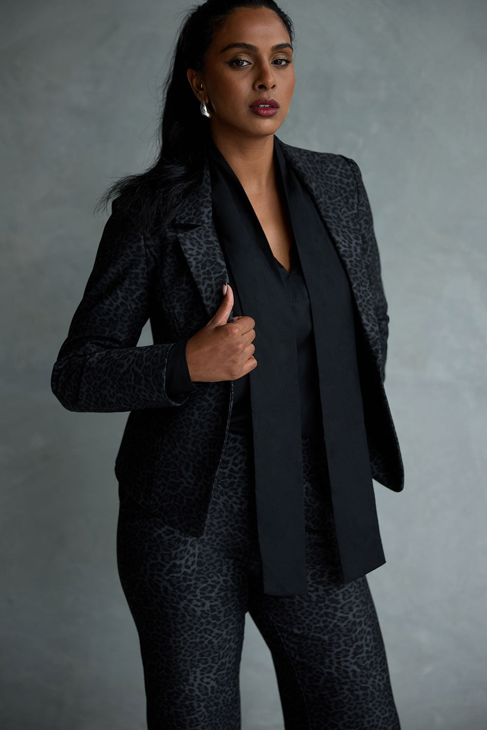 Women wears the Raleigh Jacket in Leopard print. Printed Ponti  tailored jacket that is easy care and has a matching pant. Comfortable and easy care. Made in Australia for women size 8 - 24. 
