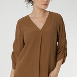 The Terry Shirt—a timeless wardrobe staple designed for effortless sophistication and everyday wear. Crafted from a breathable Tencel-Viscose fabric with a luxurious sand-washed texture and soft drape, this piece combines comfort with refined style. 