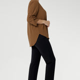  The elegant V-neckline features a tailored tuck at the centre front, while the back is finished with a subtle pleat for a touch of structure and flow. With beautifully ruched ¾ sleeves that fall gracefully toward the front of the arm, the Terry Shirt brings understated detail to a classic silhouette. Available in sizes 8-24.