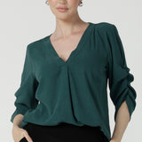 The Terry top in Alpine is a v-neckline shirt with ruched sleeves and a pleat front neckline. Made in Australia for women size 8-24. A comfortable and corporate work shirt that is fashionable and stylish. Made in Australia for size inclusive brand petite to plus size 8-24. 