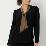 The Thom Top is a refined yet versatile addition to any wardrobe, blending elevated design with everyday ease. This elegant black long-sleeve top features soft coffee-coloured neck ties, offering flexible styling options to suit your day—tie them neatly for a polished office look or leave them open for a more relaxed, event-ready feel.