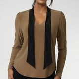 The soft V-neckline is accented by attached neck ties in a warm coffee tone, offering styling versatility—wear them tied for a polished office look or leave them loose for a more relaxed, contemporary feel. Full-length sleeves with gentle gathers at the shoulders add a touch of femininity, while the shoulder yoke and tailored tuck at the back create subtle shape without feeling structured.