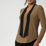 Finished with a shirttail hemline, it’s a top that layers easily under suiting and transitions seamlessly from desk to dinner. Crafted in a wrinkle-resistant, easy-care fabric, the Thom Top is made in Australia for women in Australia and New Zealand and available in inclusive sizes 8 to 24.