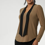 Finished with a shirttail hemline, it’s a top that layers easily under suiting and transitions seamlessly from desk to dinner. Crafted in a wrinkle-resistant, easy-care fabric, the Thom Top is made in Australia for women in Australia and New Zealand and available in inclusive sizes 8 to 24.
