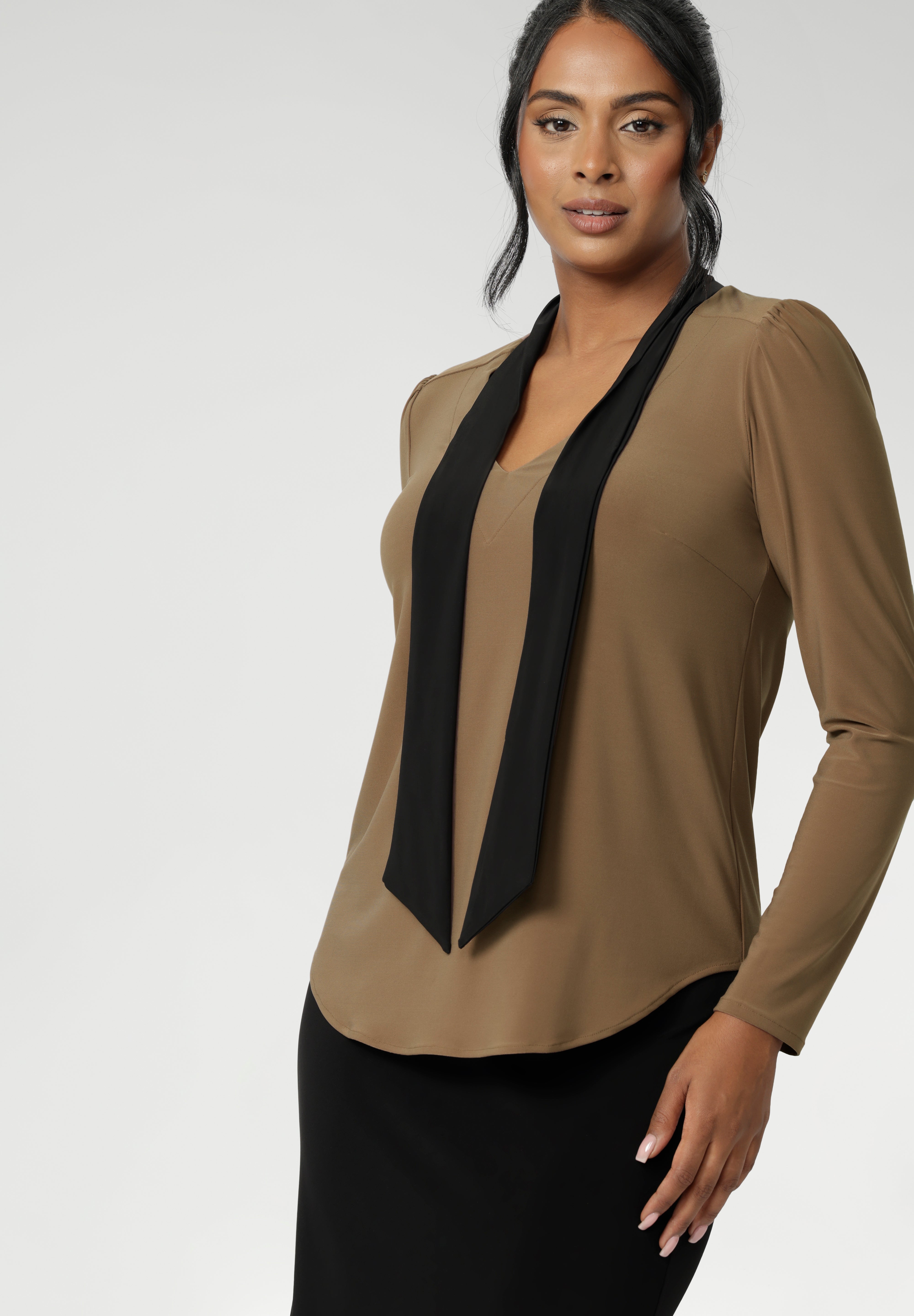 Finished with a shirttail hemline, it’s a top that layers easily under suiting and transitions seamlessly from desk to dinner. Crafted in a wrinkle-resistant, easy-care fabric, the Thom Top is made in Australia for women in Australia and New Zealand and available in inclusive sizes 8 to 24.