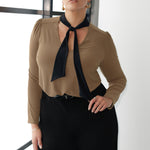 The Thom Top in black with contrasting coffee-coloured ties brings a refined edge to everyday dressing. Designed for women who want style that works across occasions, this jersey top blends comfort with quiet sophistication. Available in sizes 8-24.