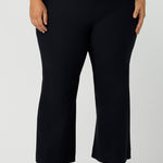 Great pants for curvy women, these flared leg, cropped pants are tailored for smart casual office wear.  Shown on a size 18 woman, these plus size navy blue pants are made in Australia by Australian and New Zealand women's clothing brand, Leina & Fleur. Shop quality pants in sizes 8 to 24 in their online fashion boutique!