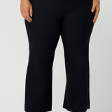 Great pants for curvy women, these flared leg, cropped pants are tailored for smart casual office wear.  Shown on a size 18 woman, these plus size navy blue pants are made in Australia by Australian and New Zealand women's clothing brand, Leina & Fleur. Shop quality pants in sizes 8 to 24 in their online fashion boutique!