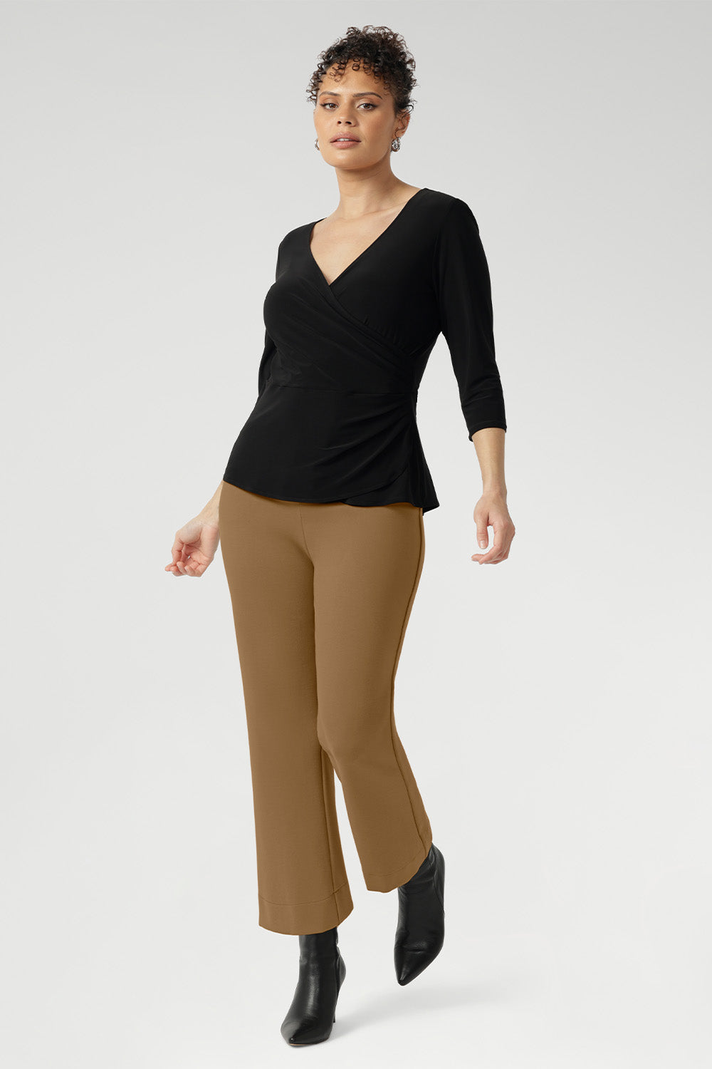 The Uma Pant is crafted from a luxurious caramel dry-touch ponte jersey. This mid-rise, pull-on style features a cropped length, subtle flared leg, and refined front waist pockets for a tailored yet effortless feel. Designed to pair seamlessly with the matching Zander Jacket.