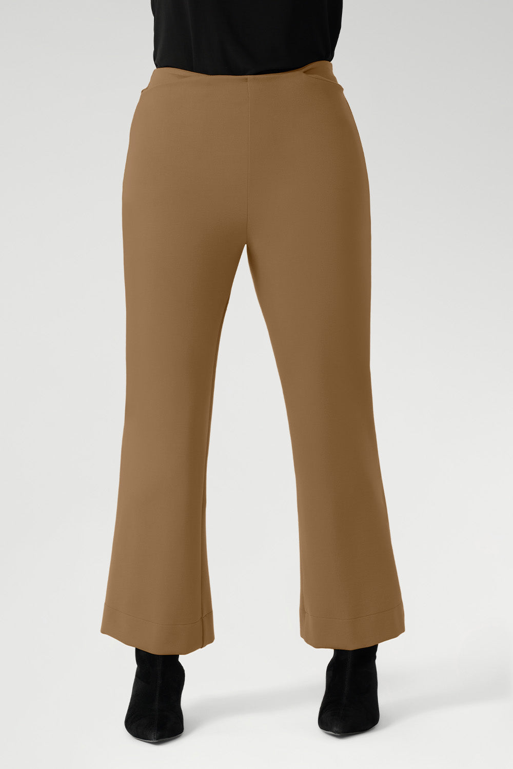 This mid-rise, pull-on style features a cropped length, subtle flared leg, and refined front waist pockets for a tailored yet effortless feel. Designed to pair seamlessly with the matching Zander Jacket.