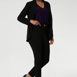 Wear this top with workwear separates as an office top or dress down with casual pants as a comfortable top for the weekend. Size 10 model wears The Vida Top in Amethyst, a V-neck top with 3/4 sleeves with black workwear pants and blazer. Made in Australia by Australian and New Zealand women's clothes brand, Leina & Fleur. 