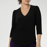 Size 10 woman wearing the Vida top in black that has a V-neckline and 3/4 sleeve. Comfortable dry touch jersey top for corporate workwear to weekend. Made in Australia for women sizes 8-24.