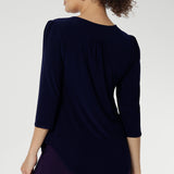 Styled with fluid suiting, the Vida Top creates a polished, professional look while remaining versatile enough for casual wear. Shown from the back, the clean lines and refined silhouette highlight its easy fit and timeless appeal. Proudly made in Australia and available in inclusive sizes 8 to 24.