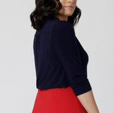 Back view of a petite size 10 woman wears a vida top in Navy with a V-neckline and 3/4 sleeves. Made in comfortable jersey for corporate workwear to casual wear. Made in Australia for women size 8 - 24.