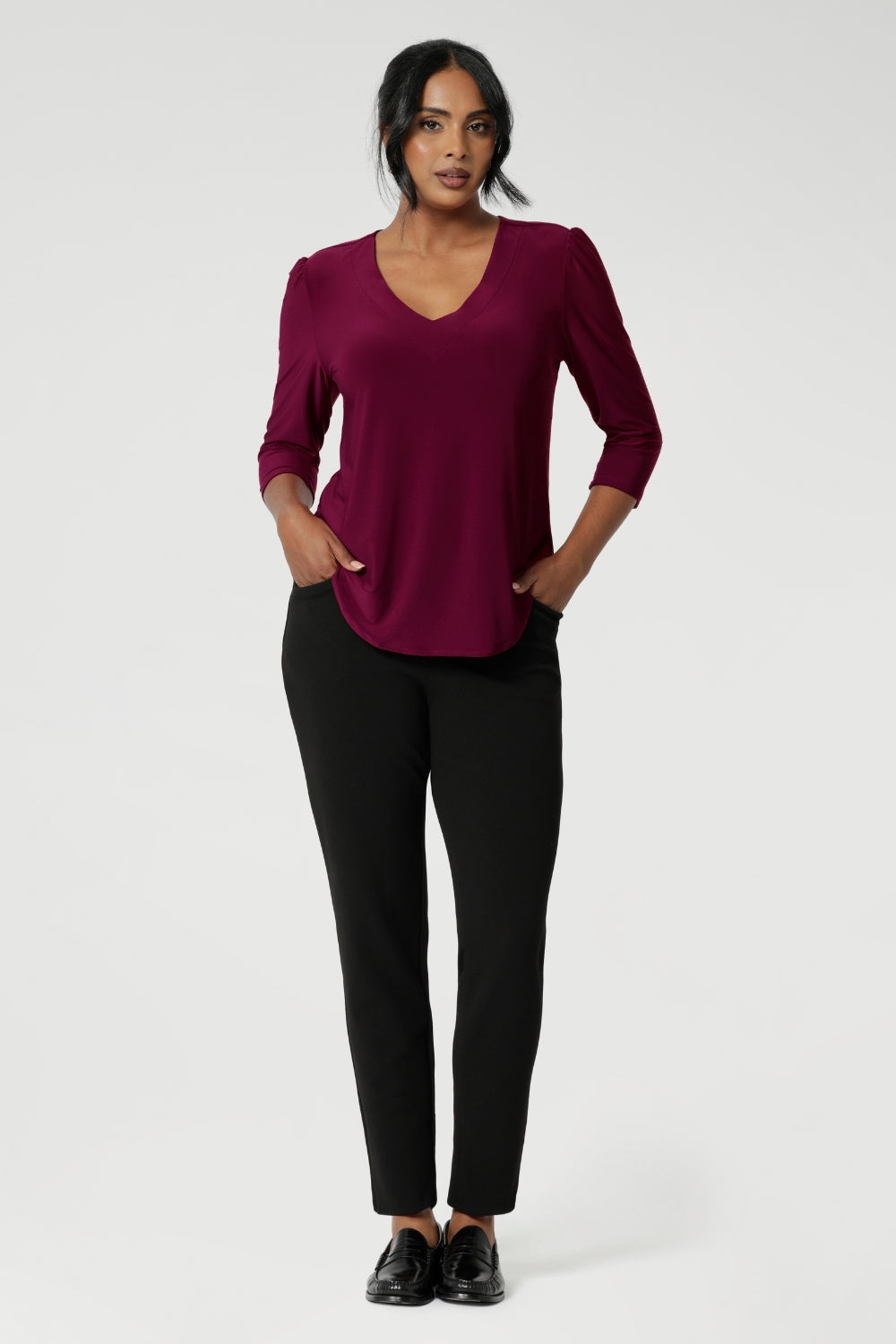 The back shoulder yoke and center-back gathers provide extra structure and comfort. The shirttail hemline offers a polished finish, making it ideal for both tucked-in and untucked styling.