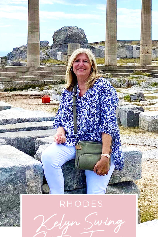 Loyal customer of Australian and New Zealand women's clothing label, L&F, Susan wears a blue and white patterned, lightweight, Australian-made shirt in Greece, as part of her guide for over-40s women on what clothes to pack for your travel holiday.